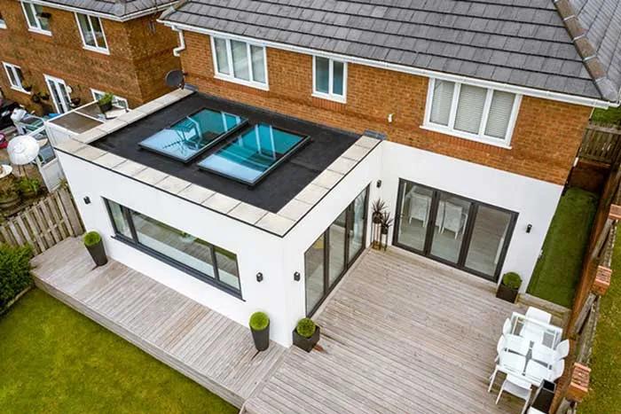 Single-storey extension with roof glazing and timber decking